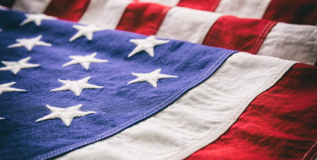 USA flag detail, closeup view. American flag background texture. Veterans Day and Professional Voicing concept