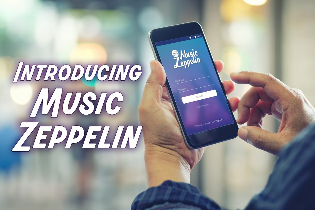 Introducing the Music Zeppelin App - Title Card - Mans hands holding smartphone with visible screen showing app login